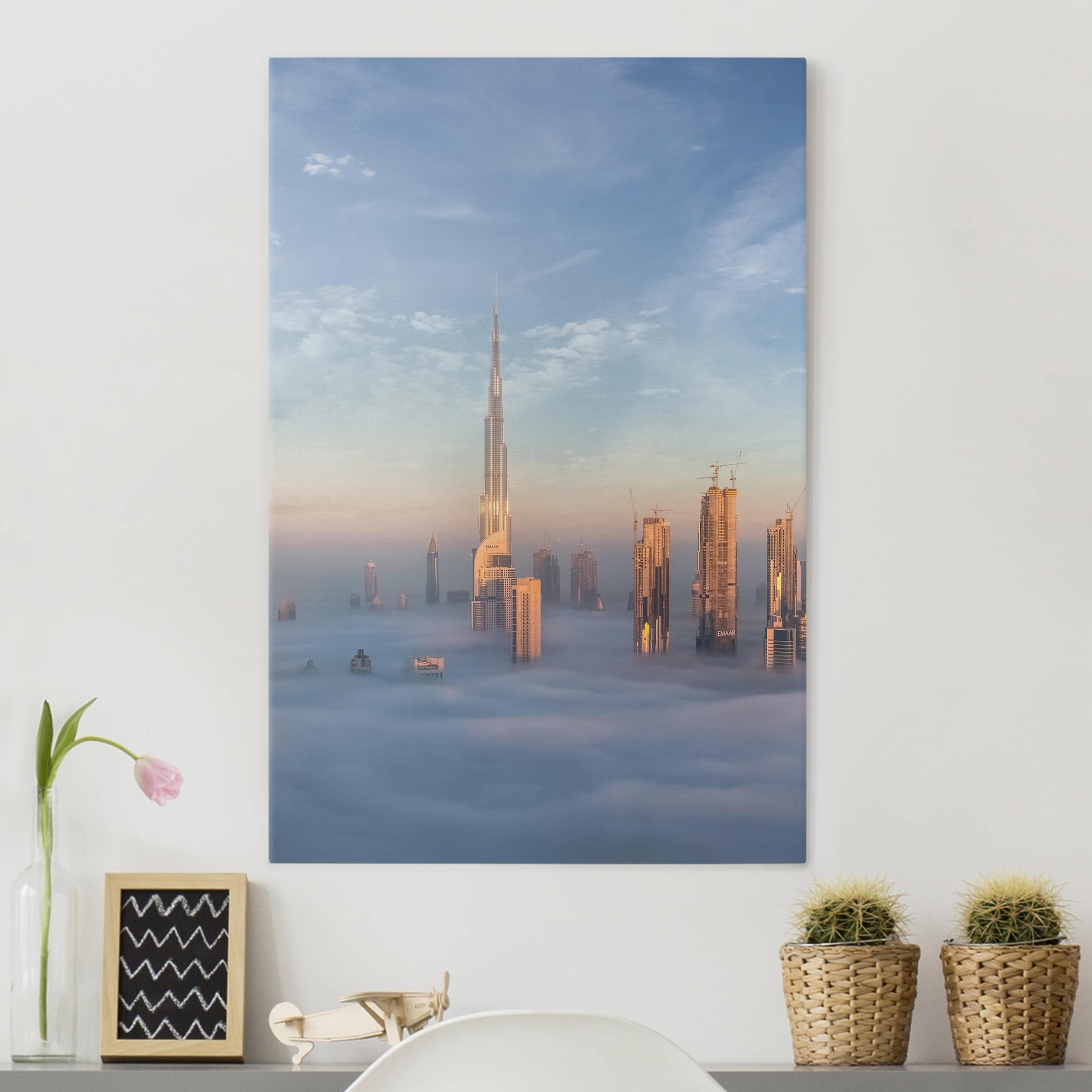 Leinwandbild - Hochformat Dubai über den Wolken