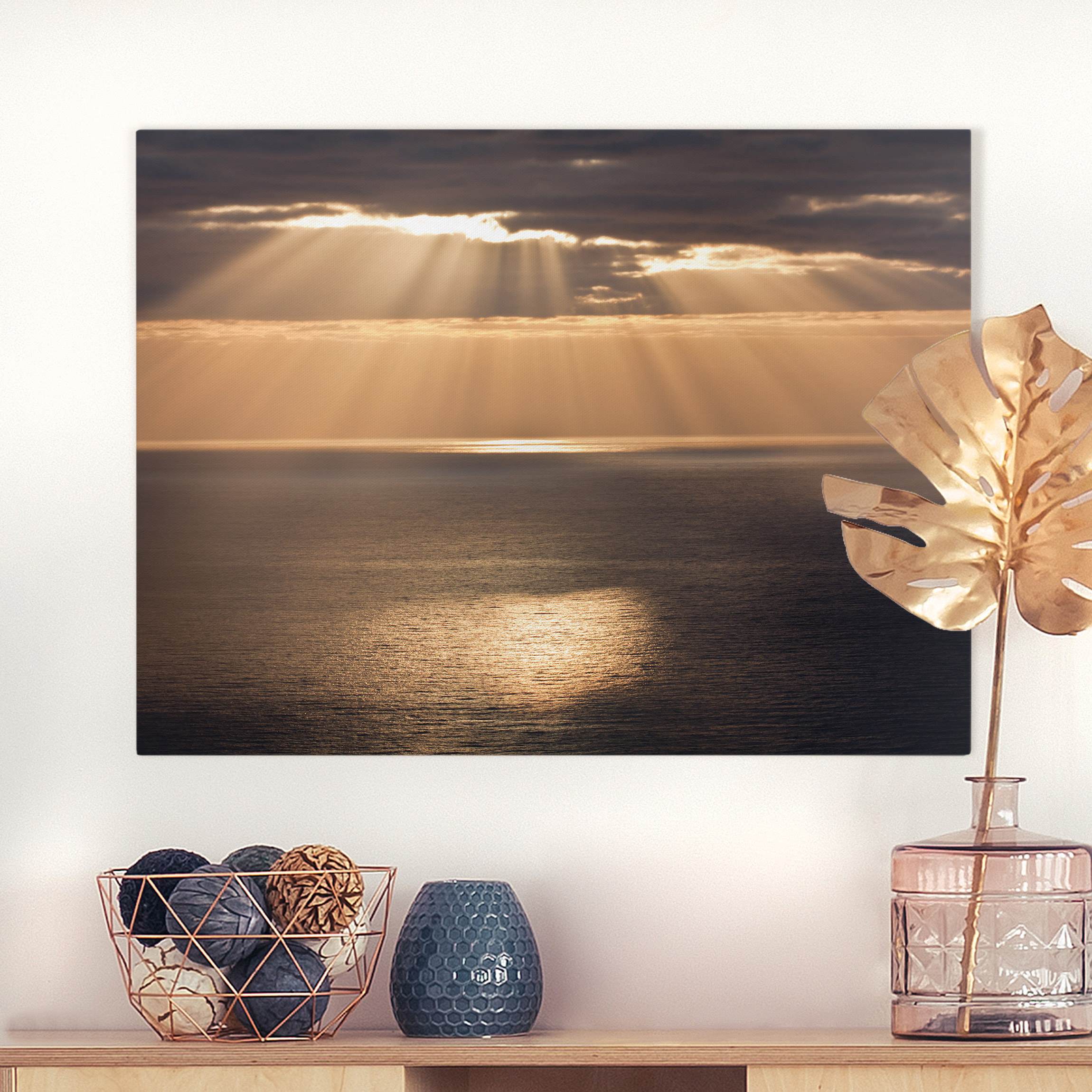 Leinwandbild Sonnenstrahlen über dem Meer