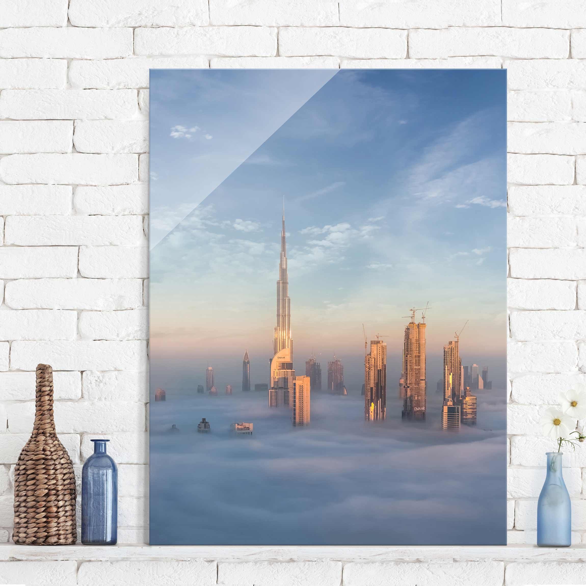Glasbild - Hochformat Dubai über den Wolken