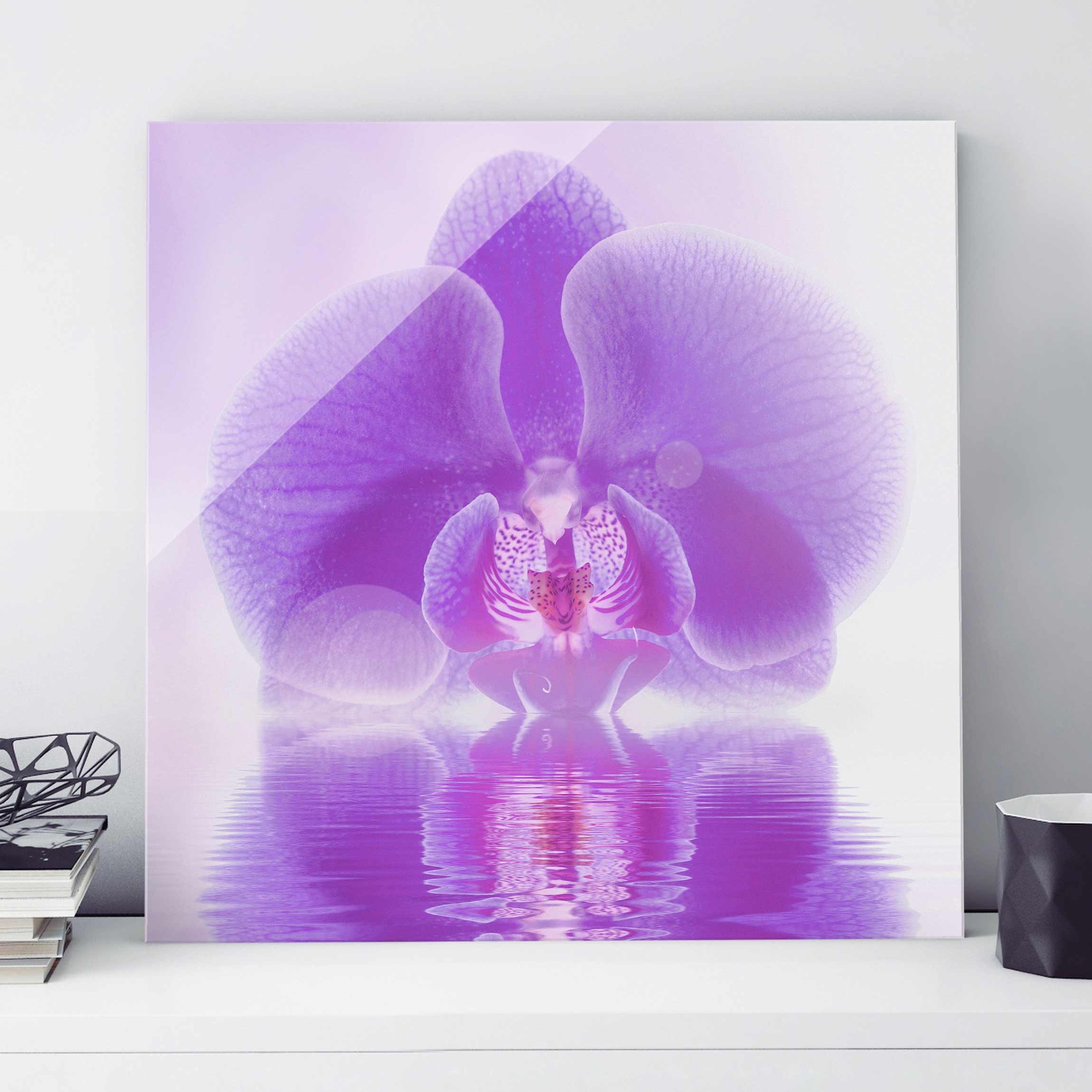 Glasbild Blumen Lila Orchidee auf Wasser