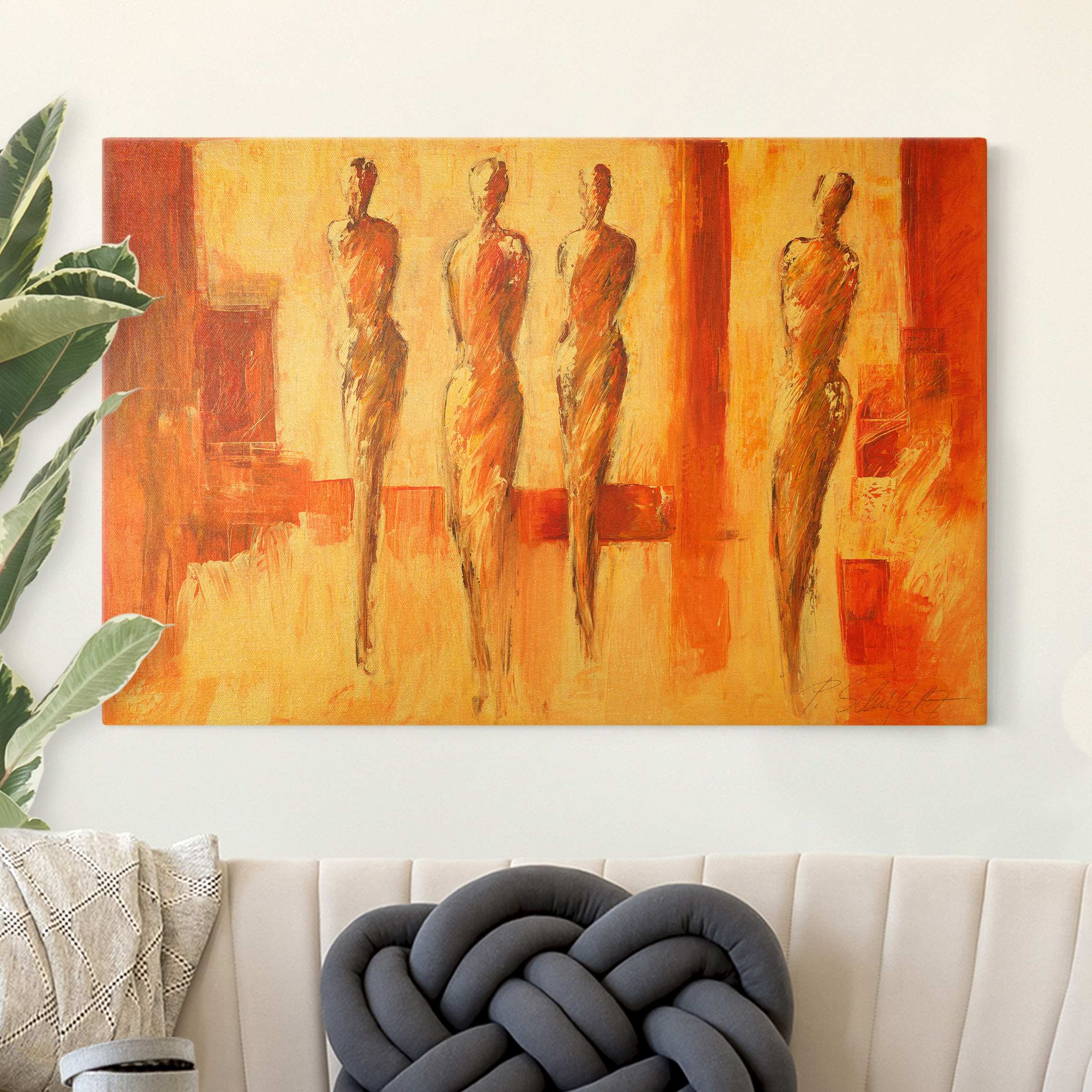 Leinwandbild Vier Figuren in Orange