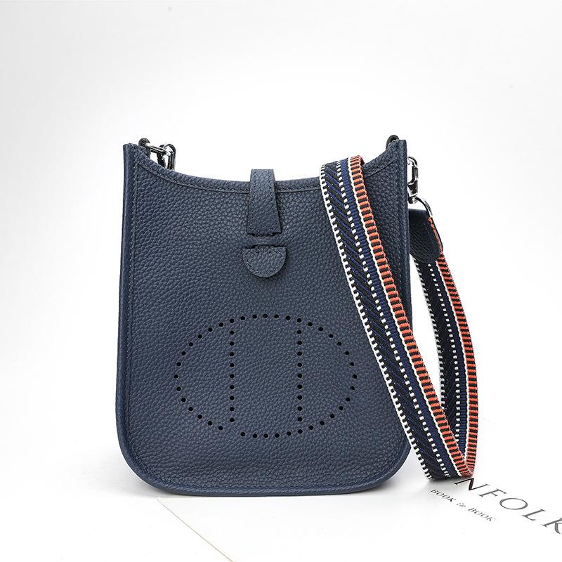 Fabrikgroßhandel erste Schicht Rindsleder Eimer Tasche Damen Tasche Litschi Muster Hohl Einzel Schulter Crossbody Tasche Hohl Design 22x9x23cm saphir