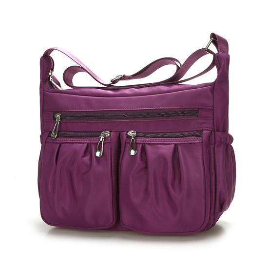 Neue Damenmode Umhängetaschen für Frauen Designer Wasserdichte Nylonhandtasche Reißverschluss Geldbörsen Messenger Umhängetasche 26*9*20cm violett