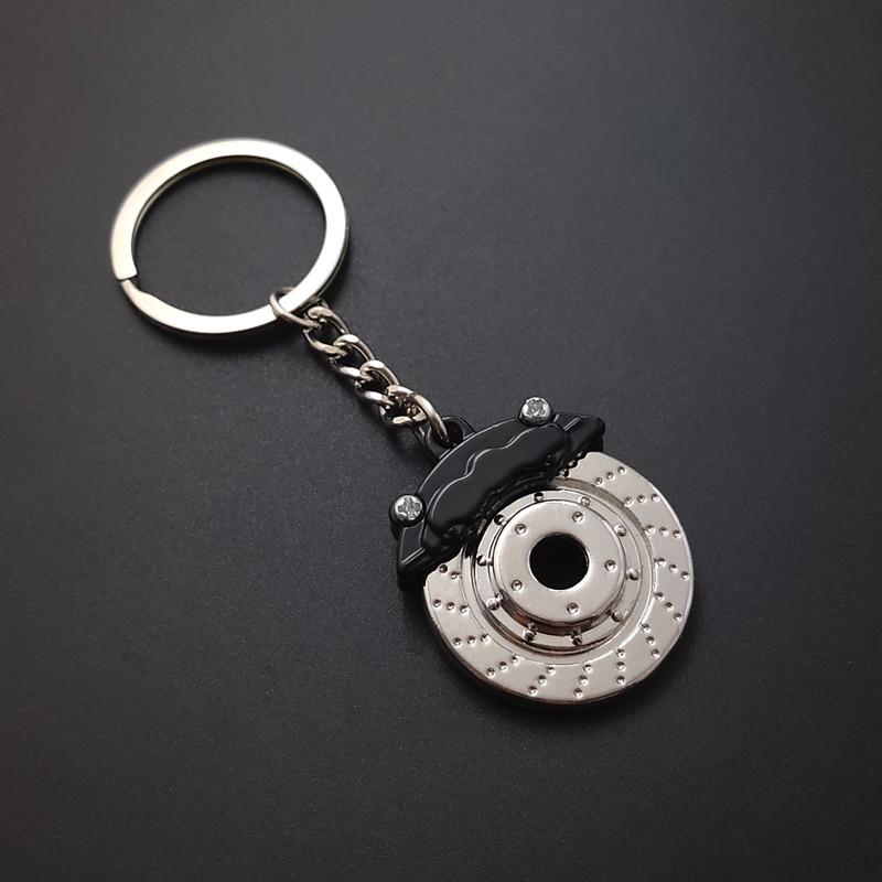 Niedlicher Metall-Autoteile-Scheibenbremsen-Schlüsselanhänger, Naben-Bremssättel, Schlüsselanhänger für Auto, Anhänger, Schlüsselanhänger für Männer, Geschenk-Schmuckstücke schwarz