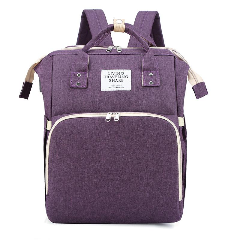 Neues faltbares Babybett mit Reisewiege und isolierter Tasche, 3-in-1-Wickeltaschen-Rucksack mit Wickelstation, tragbares Kinderbett mit Babytasche Mommy bag violett
