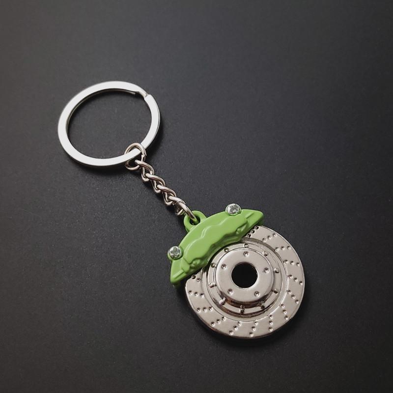Niedlicher Metall-Autoteile-Scheibenbremsen-Schlüsselanhänger, Naben-Bremssättel, Schlüsselanhänger für Auto, Anhänger, Schlüsselanhänger für Männer, Geschenk-Schmuckstücke grün