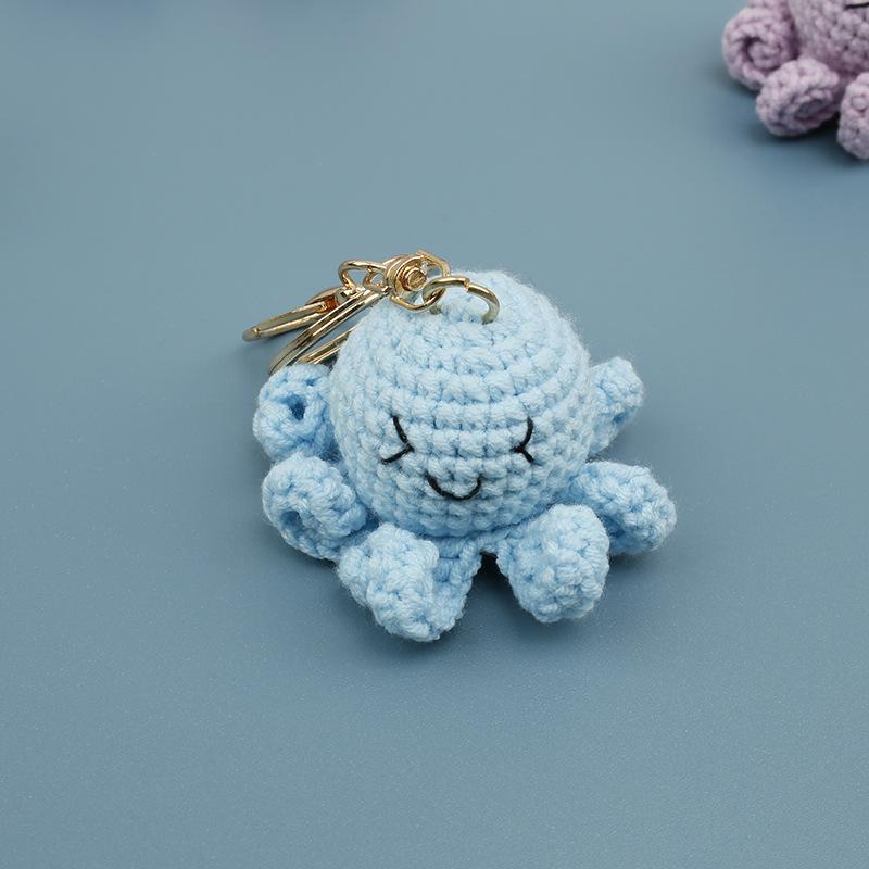 Niedliche lächelnde Oktopus-Serie Häkel-Schlüsselanhänger Handgemacht Gestrickte Sepia-Schlüsselanhänger Mini-Oktopus-Schlüsselanhänger Großhandel Individuell gray