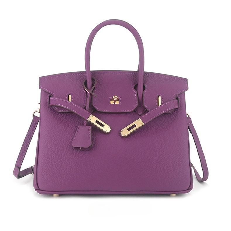 Erste Schicht togo Rindsleder große Kapazität Leder Litschi-Muster Damenmode Schloss Handtasche 25x13x19cm violett