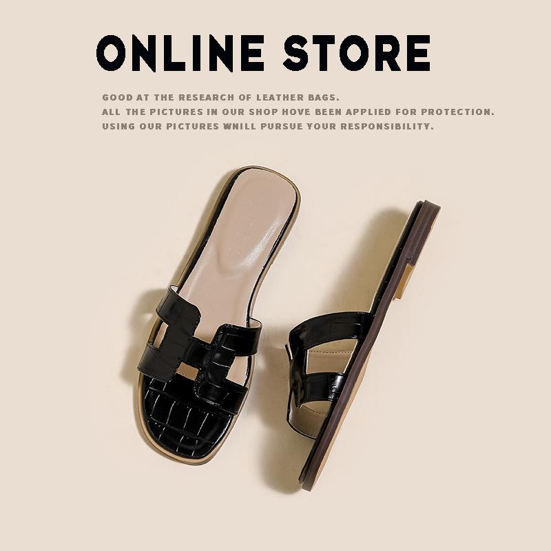 [Spot Second Hair] Sandalen Damen Sommerschuhe modische Strand flache Unterseite Ein-Wort-Ins Tide weiße Hausschuhe Damen tragen. 38 schwarz