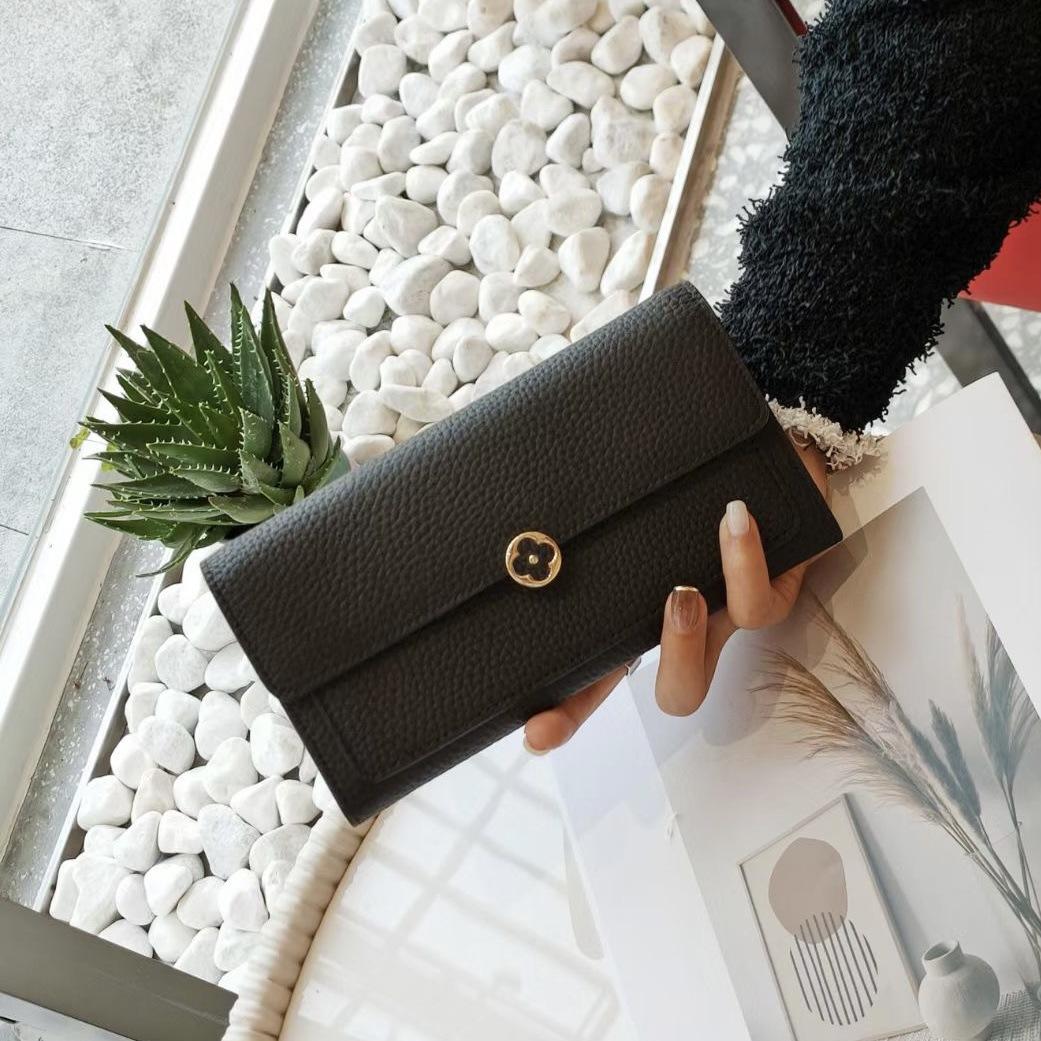Luxuriöse Damen Geldbörsen aus echtem Leder Lange Geldbörse Markendesign Pflaumenblüte Verschluss Clutch Bag Erste Schicht Rindsleder Geldbörse Brieftasche Ohne Logo schwarz
