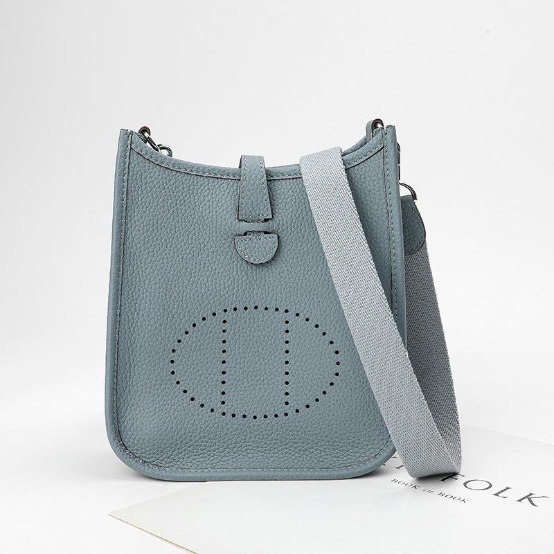 Fabrikgroßhandel erste Schicht Rindsleder Eimer Tasche Damen Tasche Litschi Muster Hohl Einzel Schulter Crossbody Tasche Hohl Design 22x9x23cm