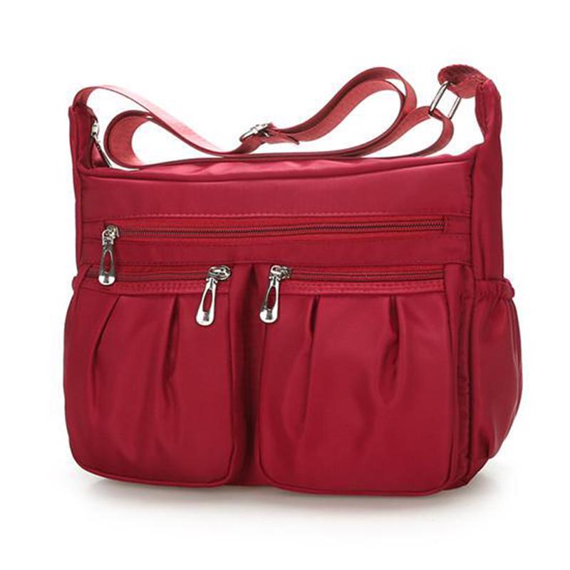 Neue Damenmode Umhängetaschen für Frauen Designer Wasserdichte Nylonhandtasche Reißverschluss Geldbörsen Messenger Umhängetasche 26*9*20cm rot