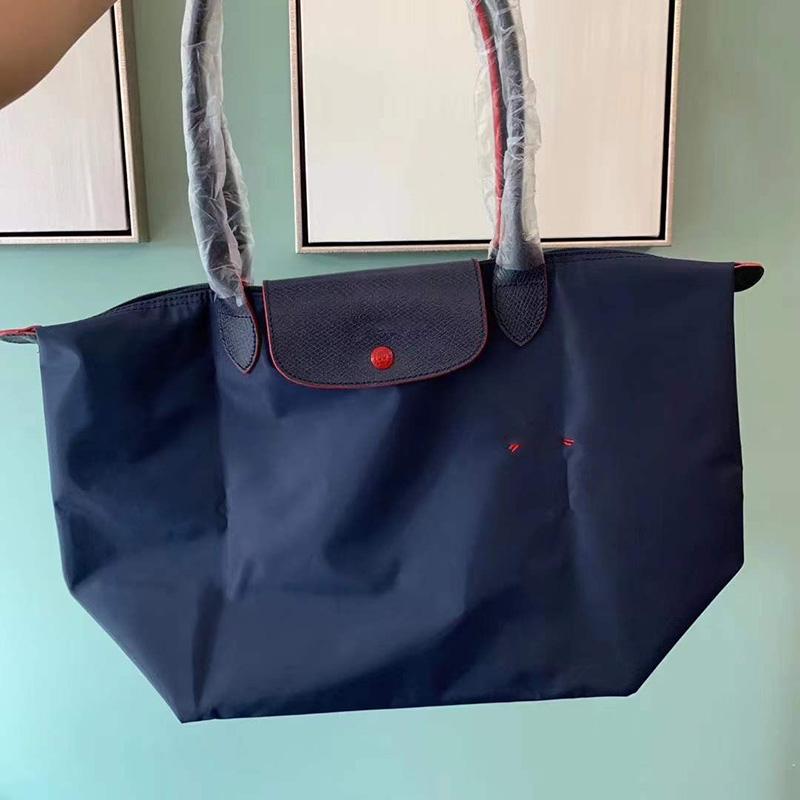 Neue Designer-Tasche Nylon Damen Handtaschen mit Logo Knödel Strandtasche Luxus-Marken-Einkaufstaschen mit Ledergriff Tragetaschen L 31cm dunkelblaue
