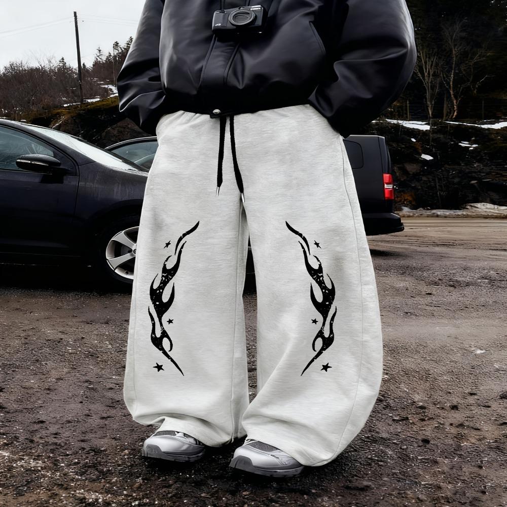Schwarze Baggy Jogginghosen für Herren, Weites Bein Design mit weißem REVOLUTION Text Flammenstickerei, Kordelzugverschluss, Street Style S