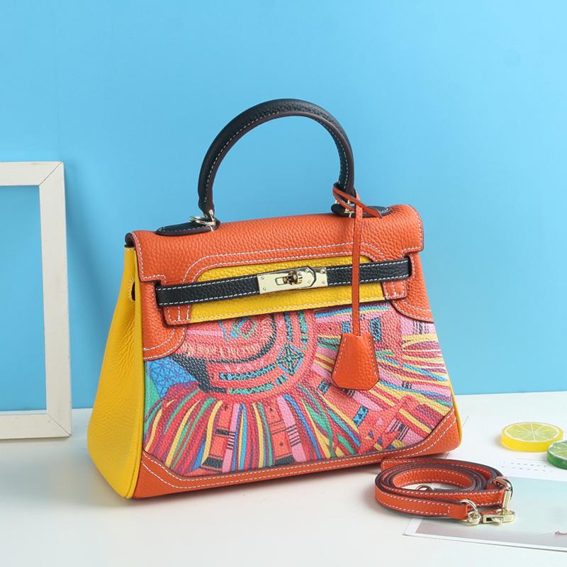 Neue Mode bedruckte Graffiti Kai Tasche Cartoon-Muster aus echtem Leder Damen Tasche Kopfschicht Leder Schulter Kreuz Schulter Handtasche 28x12x22cm orange