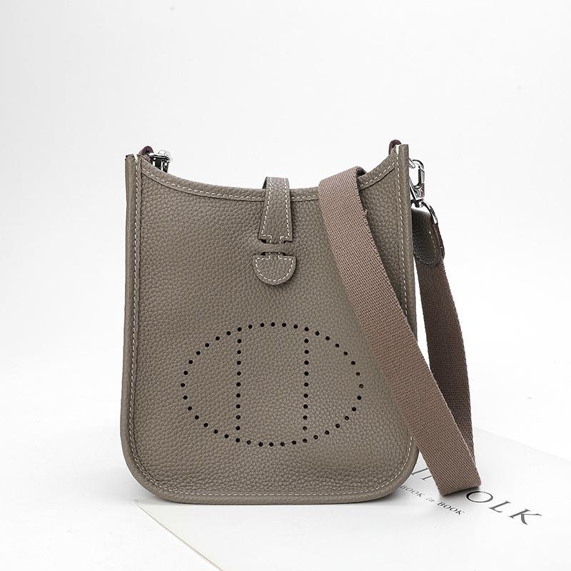 Fabrikgroßhandel erste Schicht Rindsleder Eimer Tasche Damen Tasche Litschi Muster Hohl Einzel Schulter Crossbody Tasche Hohl Design 32x9x30cm