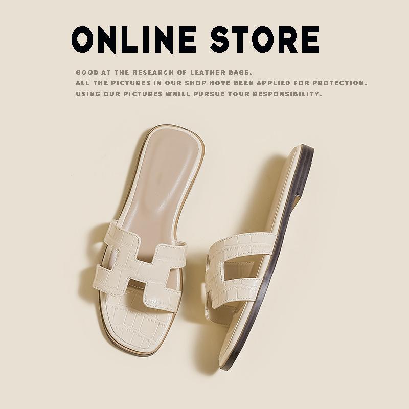 [Spot Second Hair] Sandalen Damen Sommerschuhe modische Strand flache Unterseite Ein-Wort-Ins Tide weiße Hausschuhe Damen tragen. 41 creme