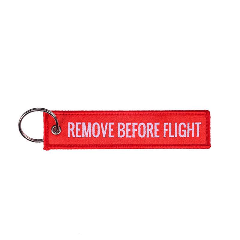 1 Stück Remove Before Flight Gewebter Schlüsselanhänger Gepäckanhänger Etikett Rot Kette Schlüsselanhänger Für Luftfahrtgeschenke Schlüsselanhänger Modeschmuck 1 Piece rot