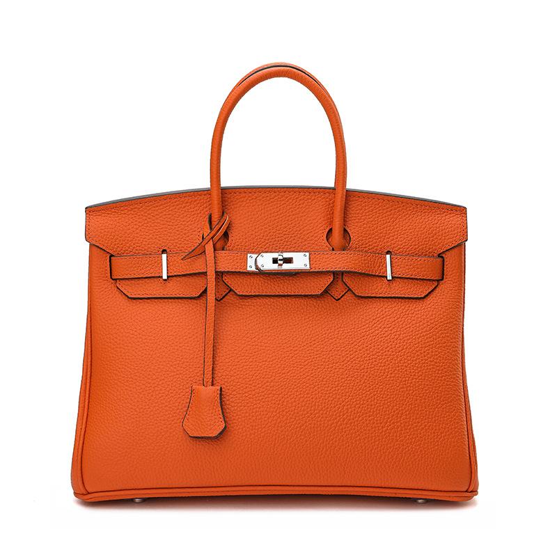Neue Silber Taste Litschi Muster Kopf Schicht Rindsleder Platin Tasche Handheld Platin Tasche Mode Echtes Leder frauen Schulter Tasche 25cm orange
