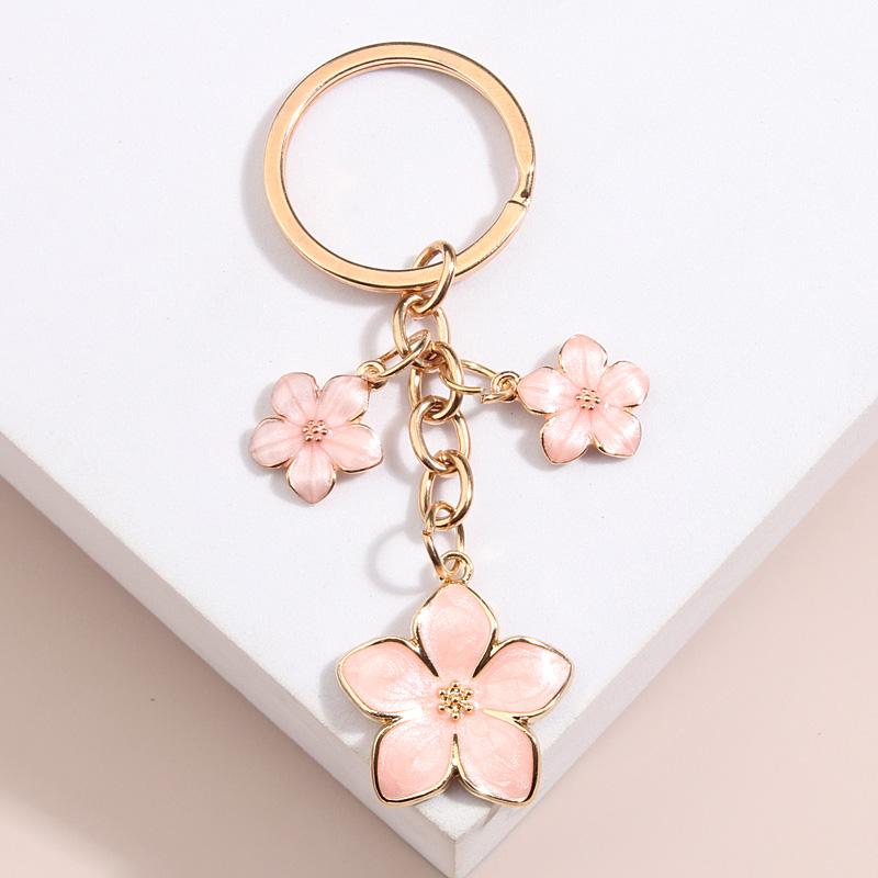 Niedlicher Schlüsselanhänger mit Pflanze, Sakura-Blume, Emaille-Schlüsselanhänger für Frauen und Mädchen, Handtaschen-Accessoire, Autoschlüssel, DIY, süßer Schmuck, Geschenke rosa