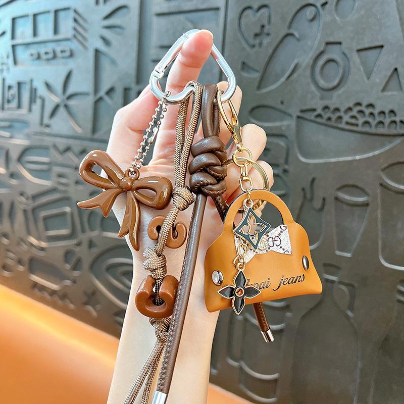 Grenzüberschreitende Wickeltasche Anhänger Mini-Tasche Schlüsselanhänger Anhänger PU Auto-Anhänger Taschenzubehör High-End Kleine Geschenke braun
