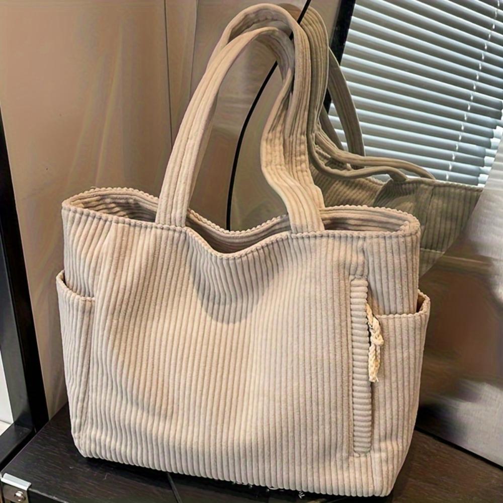 Eine lässige Handtasche aus Cord mit Reißverschluss, leicht und mit großem Fassungsvermögen, festem Schultergurt und Polyesterfutter, solide Handtasche für den täglichen Gebrauch beige