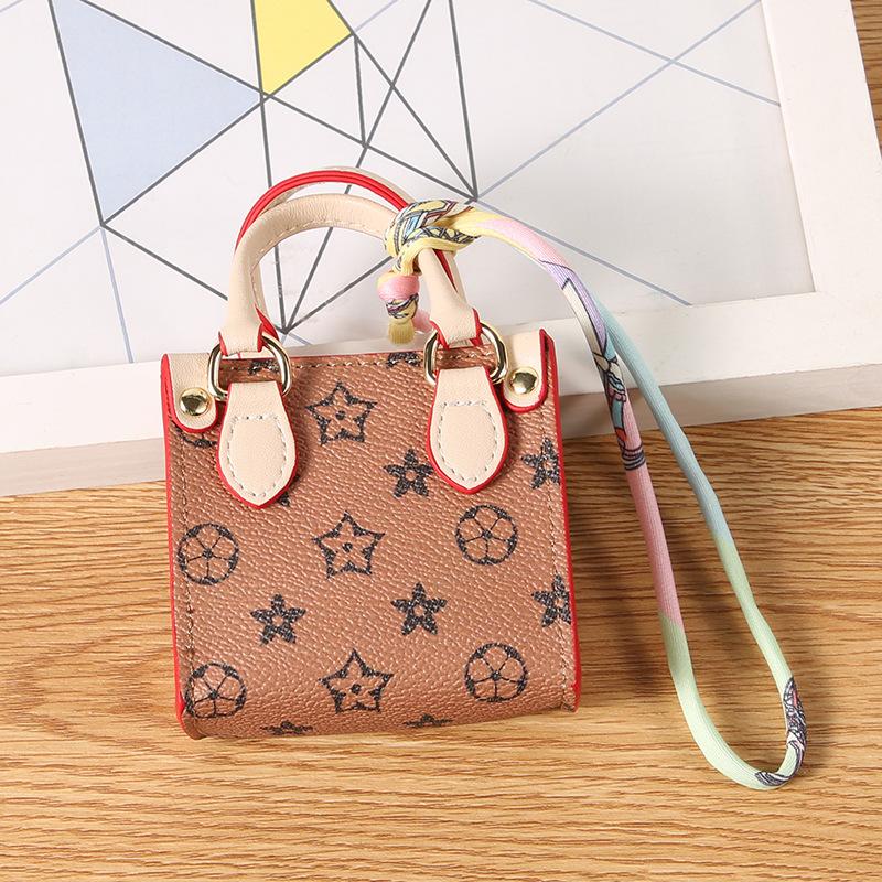 Tragetasche Mini-Wechselgeldbeutel Mini-Tasche Anhänger Kopfhörertasche Schlüsseltasche Autoanhänger Überraschung Baby-Mini-Tasche kaffeebraun