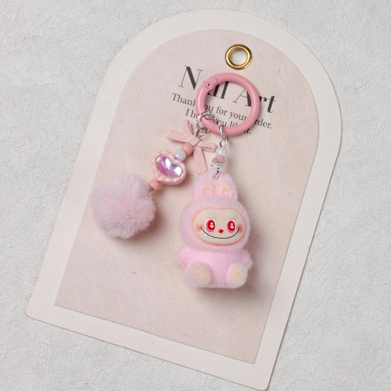 Sitzender Beflockungs-Schlüsselanhänger DIY Niedliche Korn Einzelpuppen-Zubehör Weichkleber Niedliches Korn Baby Lauftasche Handy-Anhänger 1pc