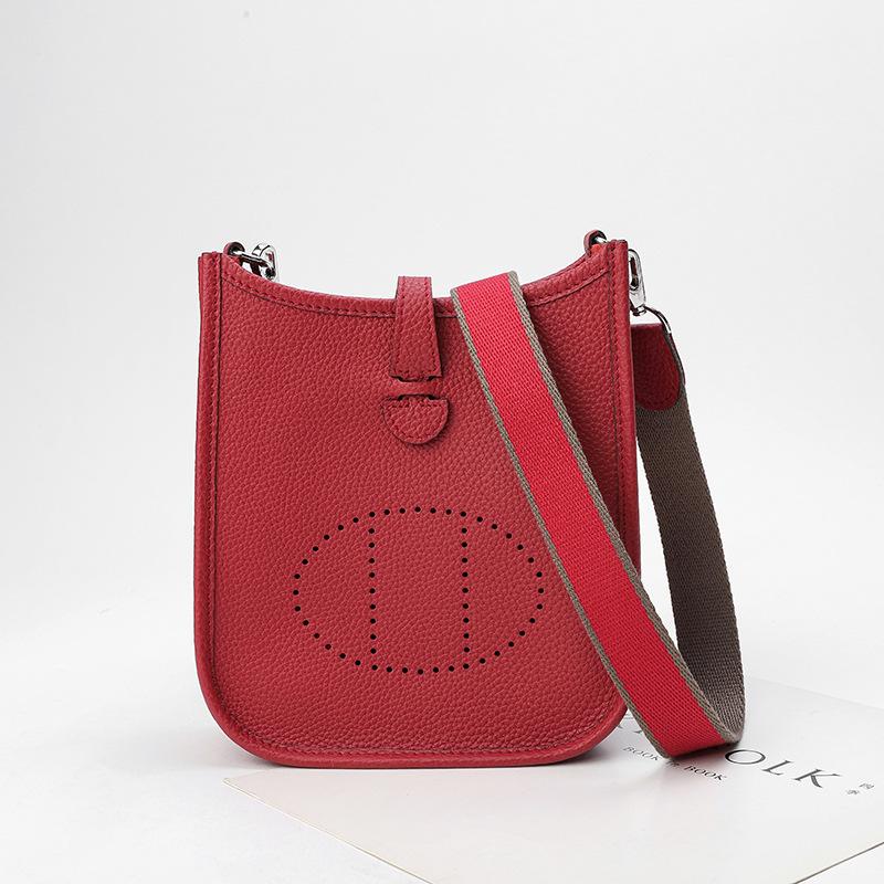 Fabrikgroßhandel erste Schicht Rindsleder Eimer Tasche Damen Tasche Litschi Muster Hohl Einzel Schulter Crossbody Tasche Hohl Design 32x9x30cm rot