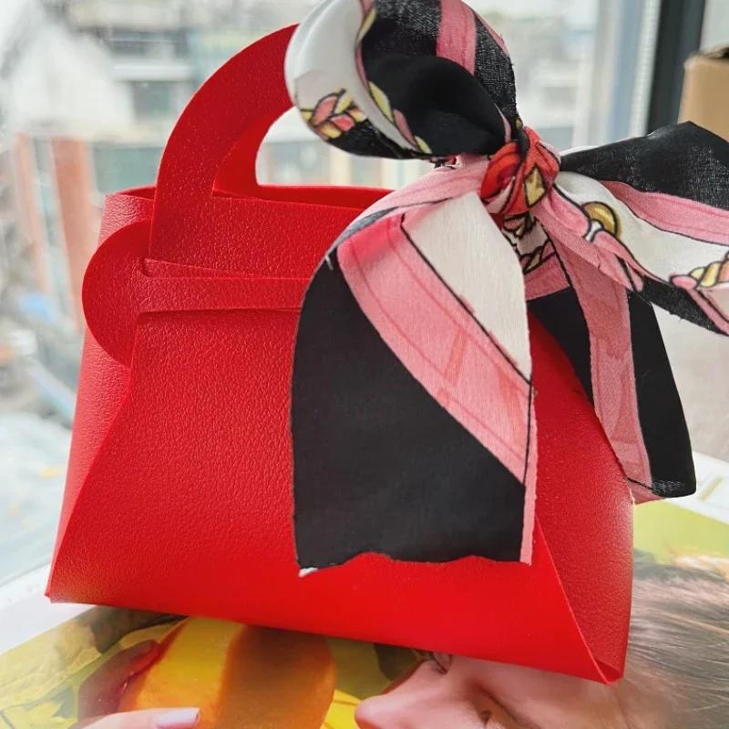 Verteilen Sie rosa Geschenktüten aus Leder für Hochzeitsgeschenke, Mini-Handtasche mit Band, Süßigkeiten-Verpackungsbox, Party-Dekoration rot