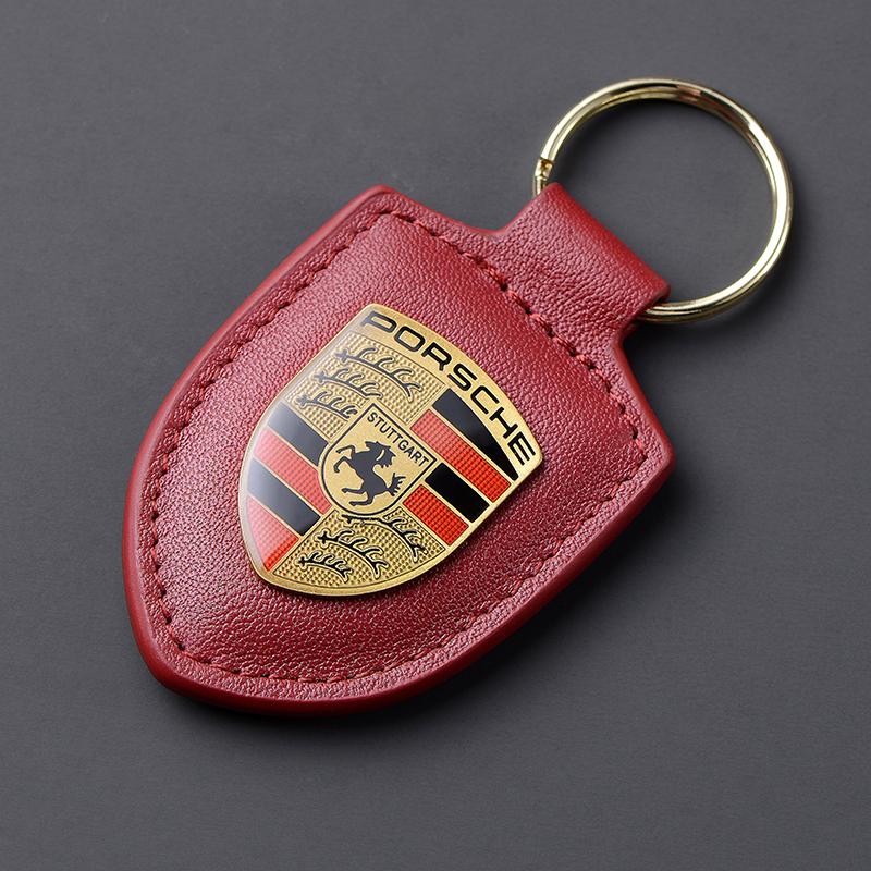 Leder Schild Emblem Auto Schlüsselanhänger Metall Luxus Schlüsselanhänger Für Porsche Cayenne Panamera Macan 911 718 Taycan Boxster Cayman 918 wein rot