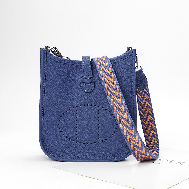 Fabrikgroßhandel erste Schicht Rindsleder Eimer Tasche Damen Tasche Litschi Muster Hohl Einzel Schulter Crossbody Tasche Hohl Design 17x6x18cm