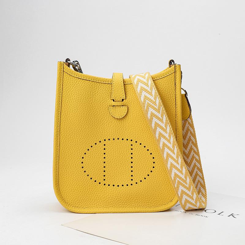 Fabrikgroßhandel erste Schicht Rindsleder Eimer Tasche Damen Tasche Litschi Muster Hohl Einzel Schulter Crossbody Tasche Hohl Design 17x6x18cm