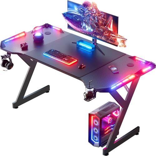 HLONONE LED Gaming Schreibtisch 120 x 60 cm, Gaming Tisch mit LED, Stabiler PC Tisch mit Kohlefaserbeschichtung, Gamer Tisch mit Getränkehalter und Kopfhörerhaken, Schwarz