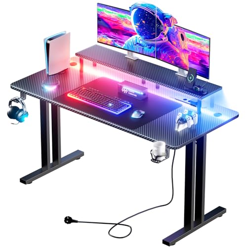 HLONONE Gaming Tisch mit LED, 120x60 cm Gaming Schreibtisch mit 3 Steckdosen und 2 USB Anschlüssen, PC Gamer Tisch mit Monitorständer, Stabiler Computertisch für Gaming und Büro, Schwarz