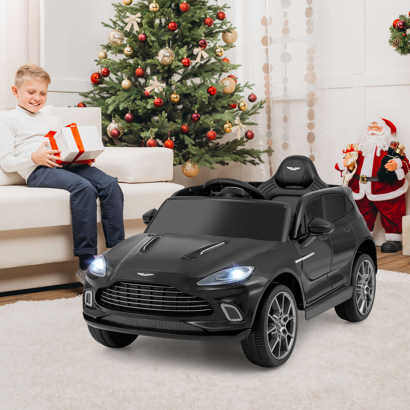 Elektrisches Kinderauto Aston Martin lizenzierter Elektrofahrzeug mit Hupe Musik & LED-Lichtern Schwarz