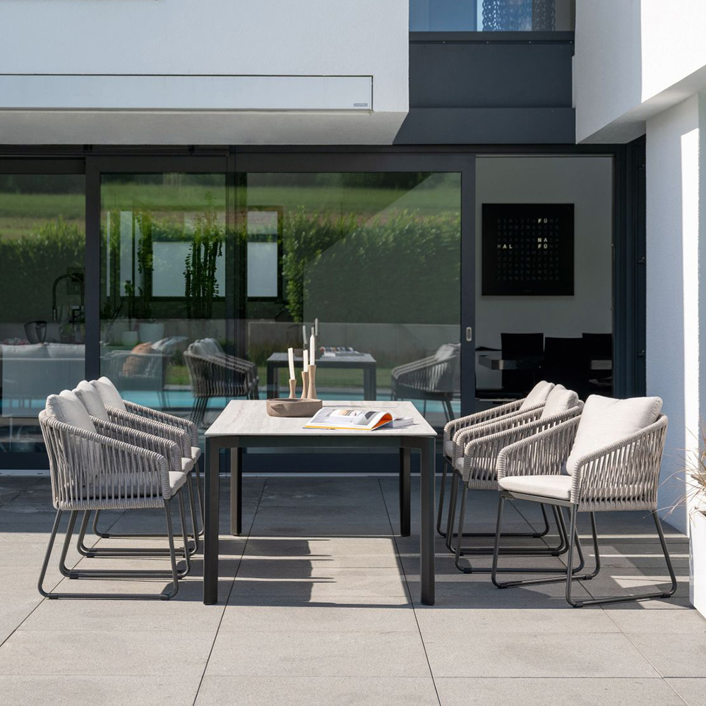 Stern 6x Kufensessel Marla anthrazit Kordel salt Kissen graubraun mit Tischgestell 220x100 cm Penta Tischplatte Dekton Sediment